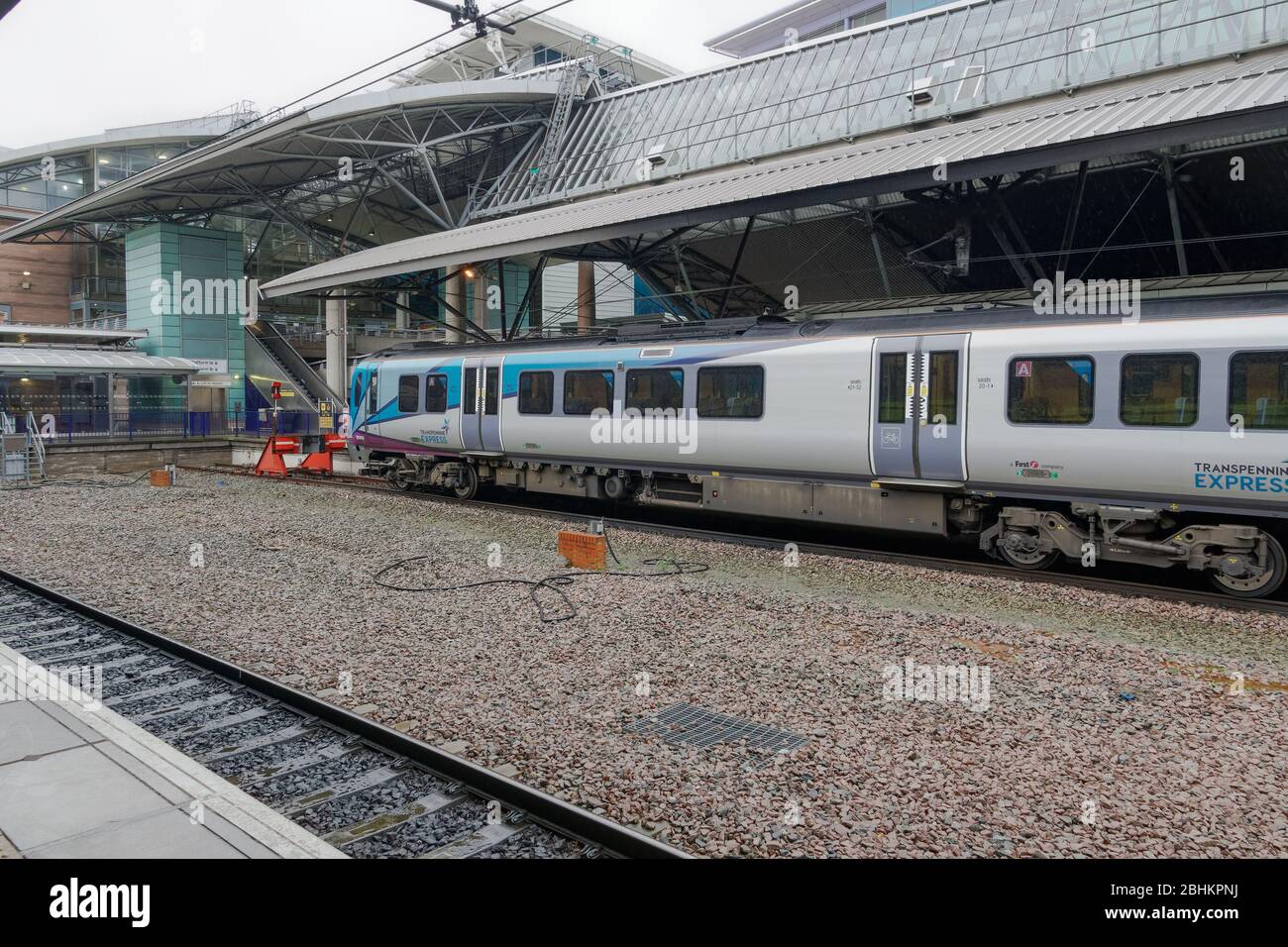Manchester UK airport train stopped at station. Transpennine Express at
