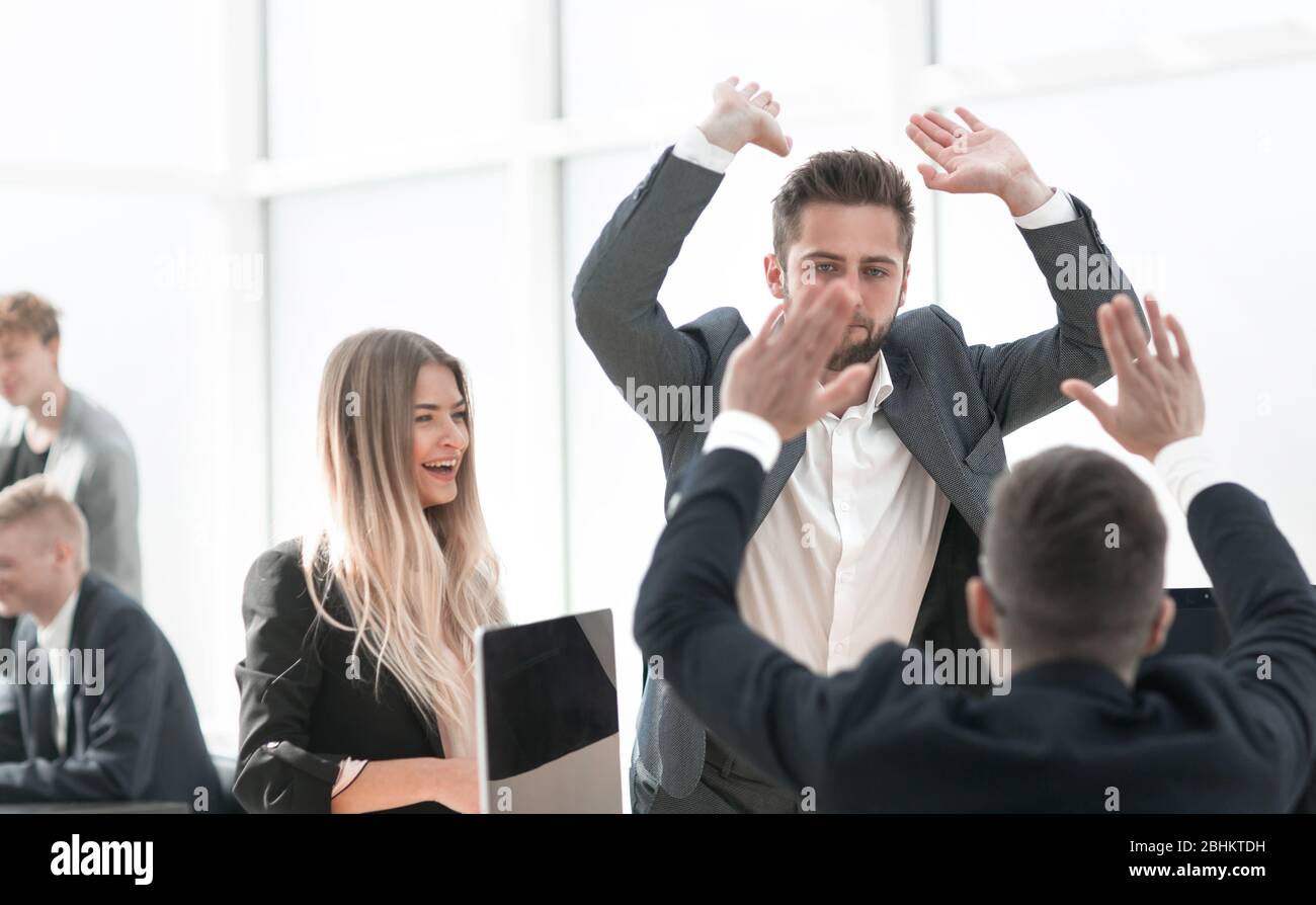 happy employees giving each other a high five Stock Photo - Alamy