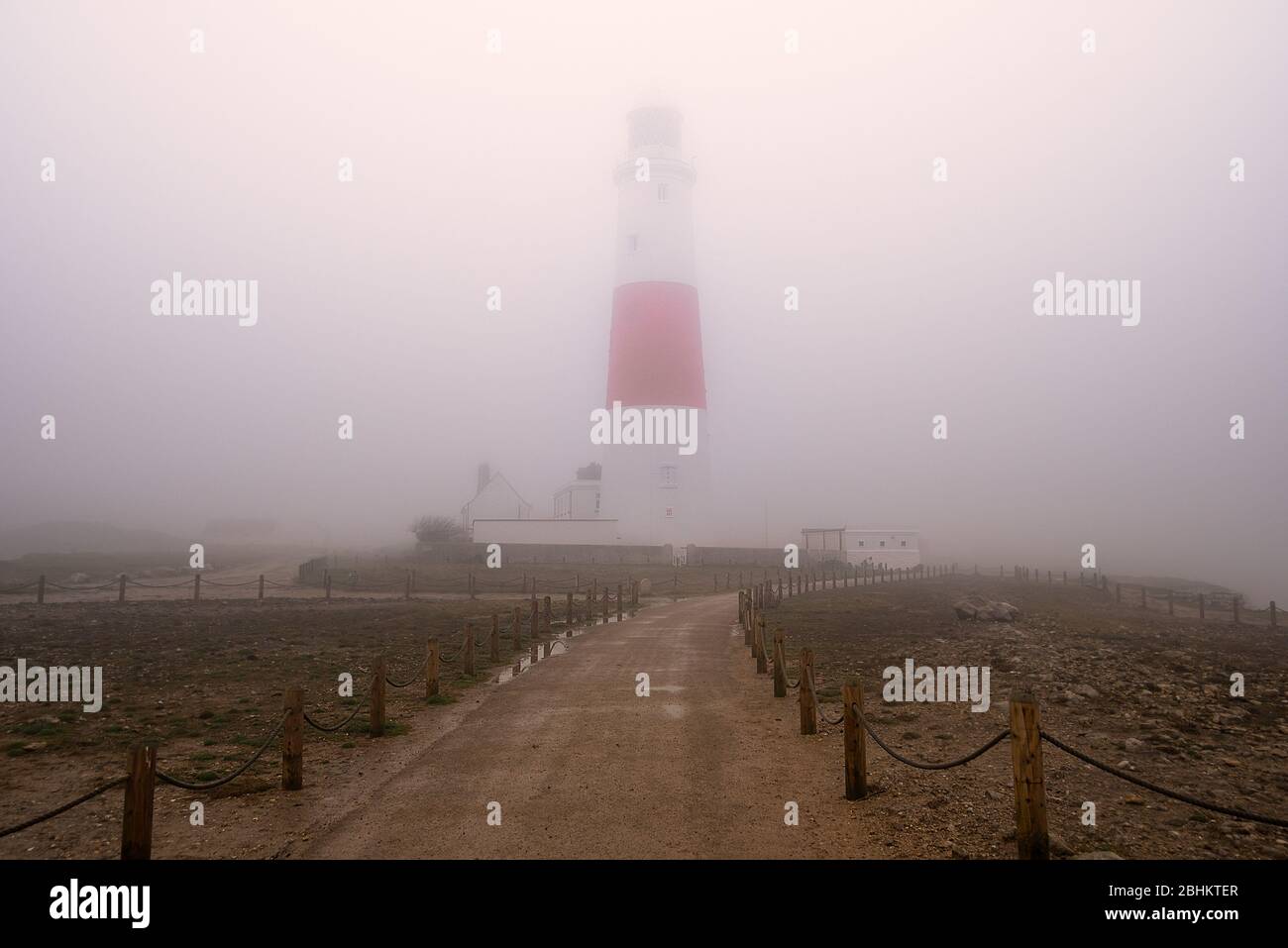 Portland Bill Lighthouse in heavy fog. Stock Photo
