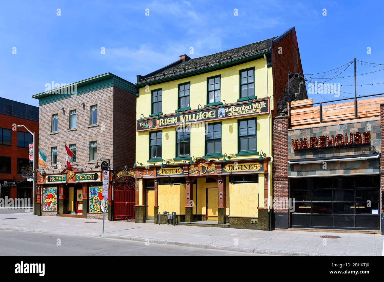 Ottawa, Canada - April 25, 2020: Popular restaurant/bars on the usually busy Clarence Street in the Byward Market boarded up and closed during the COV Stock Photo