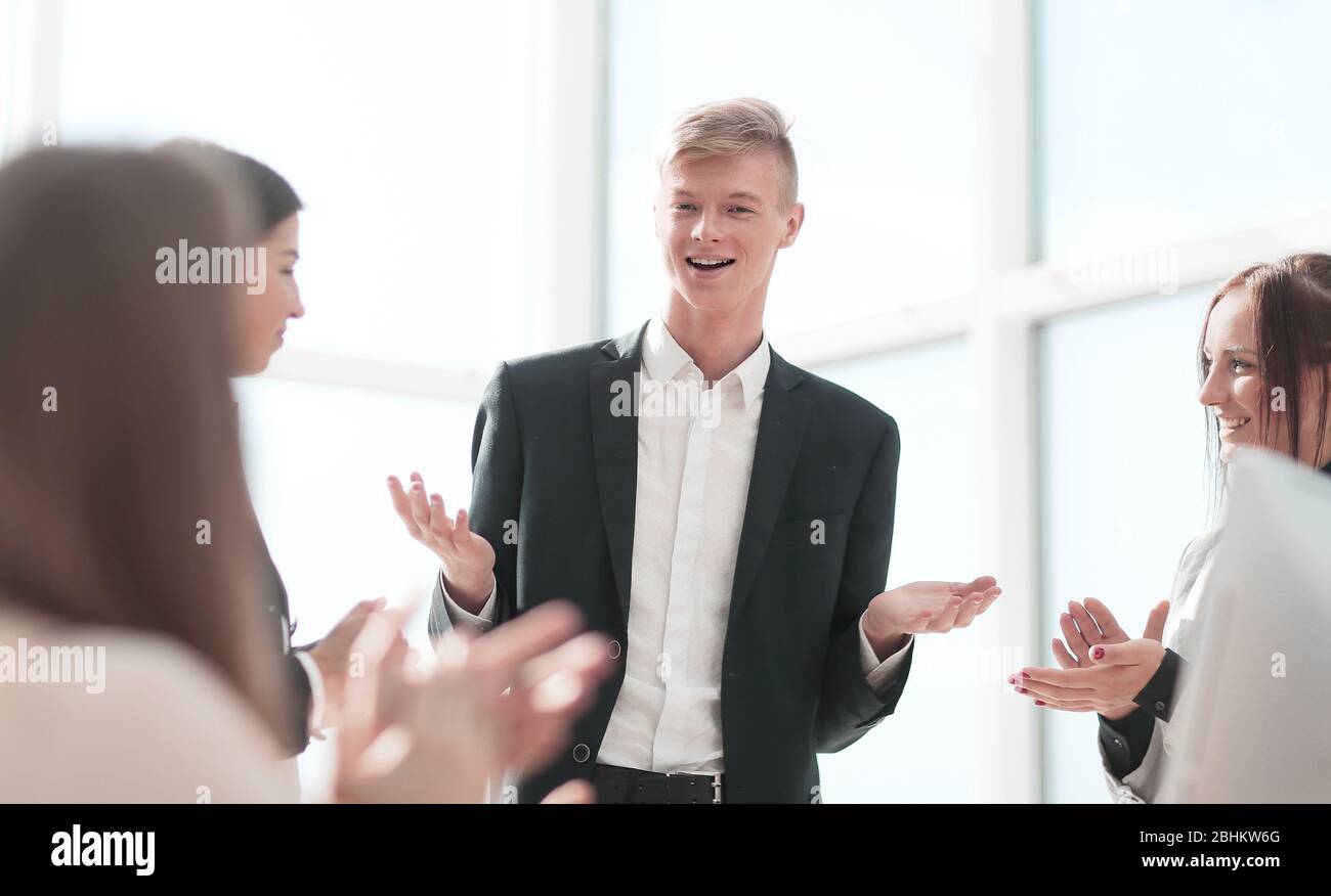 happy leader standing in front of his business team Stock Photo - Alamy