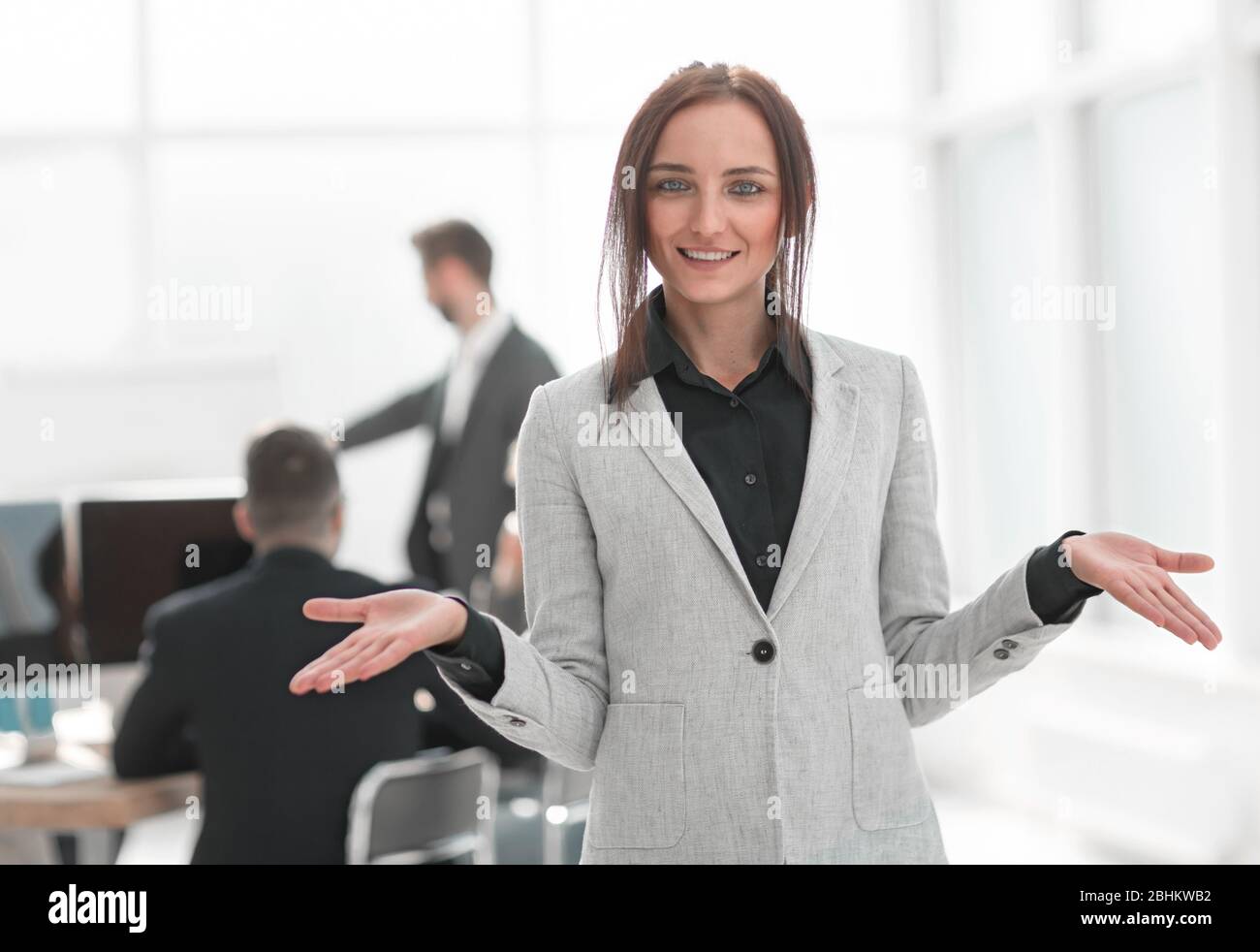portrait of a successful young business woman on an office background ...