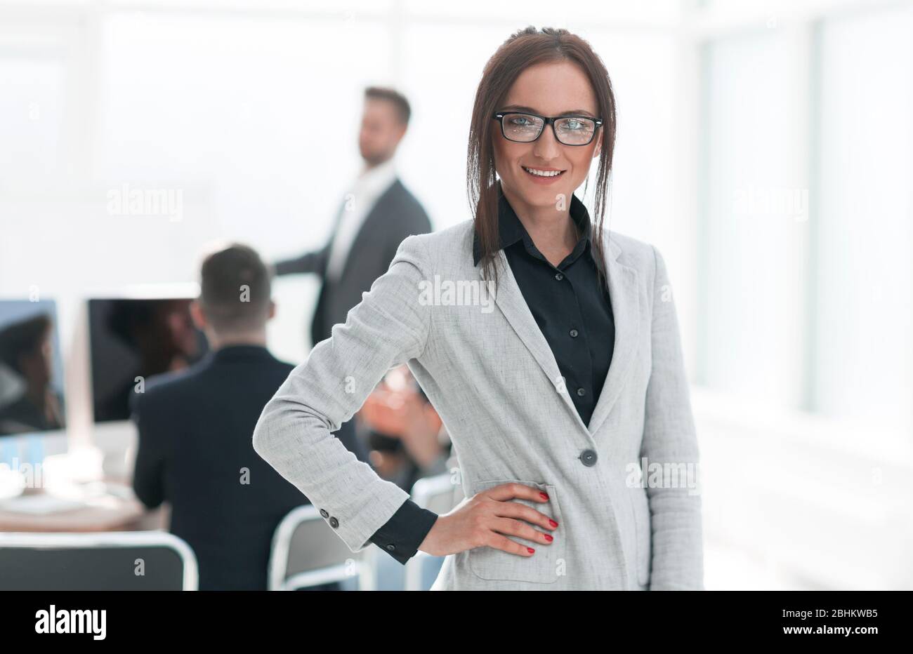 portrait of a successful young business woman on an office background ...