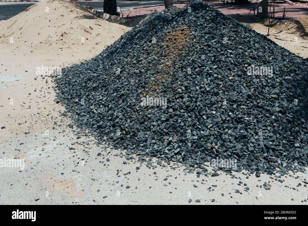 Rough stones, crushed stone, granite gravel close-up. The rough texture of the stone. Building material background. Texture Stock Photo