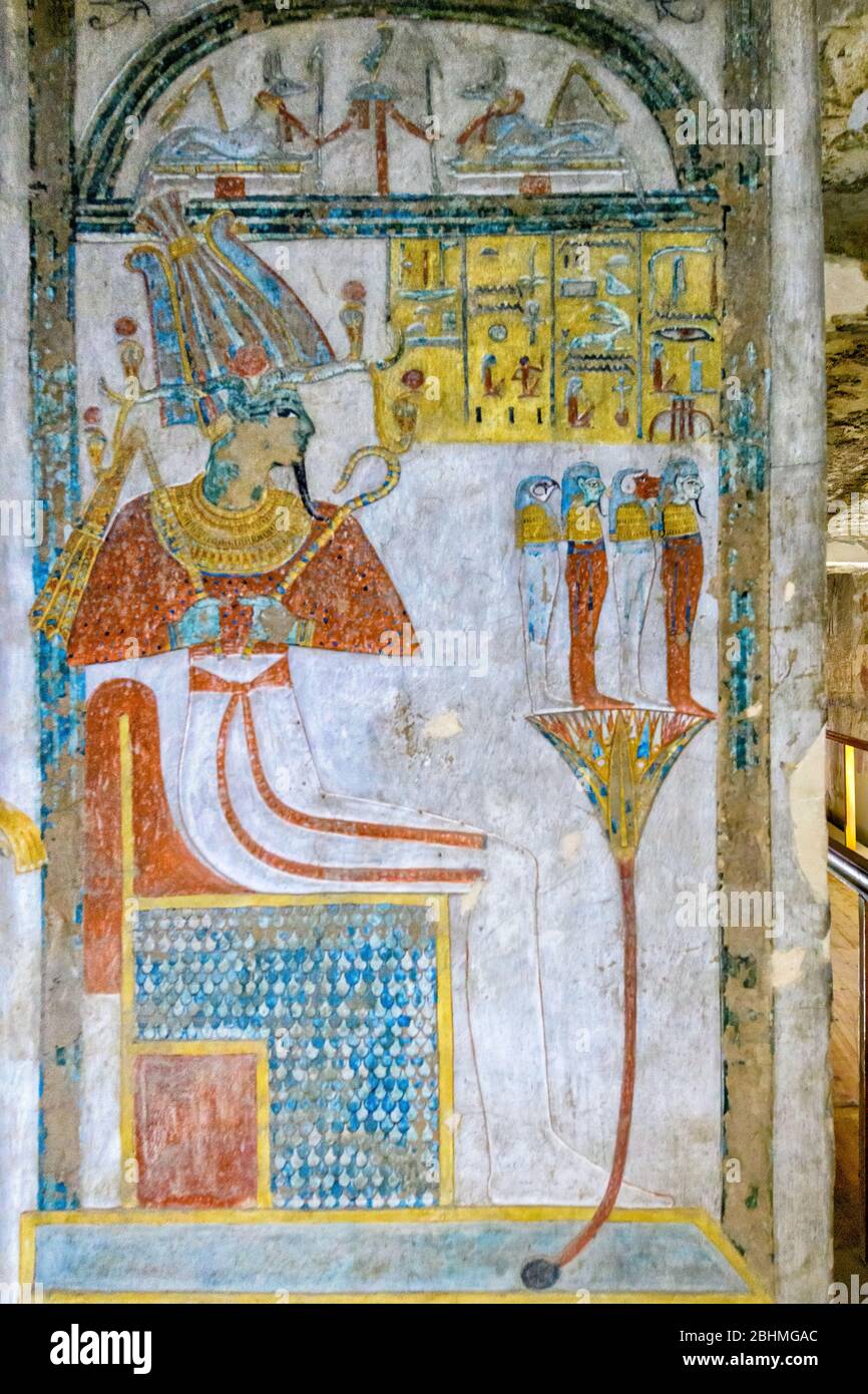 Osiris enthroned in a shrine with the four sons of Horus on a lotus Stock Photo