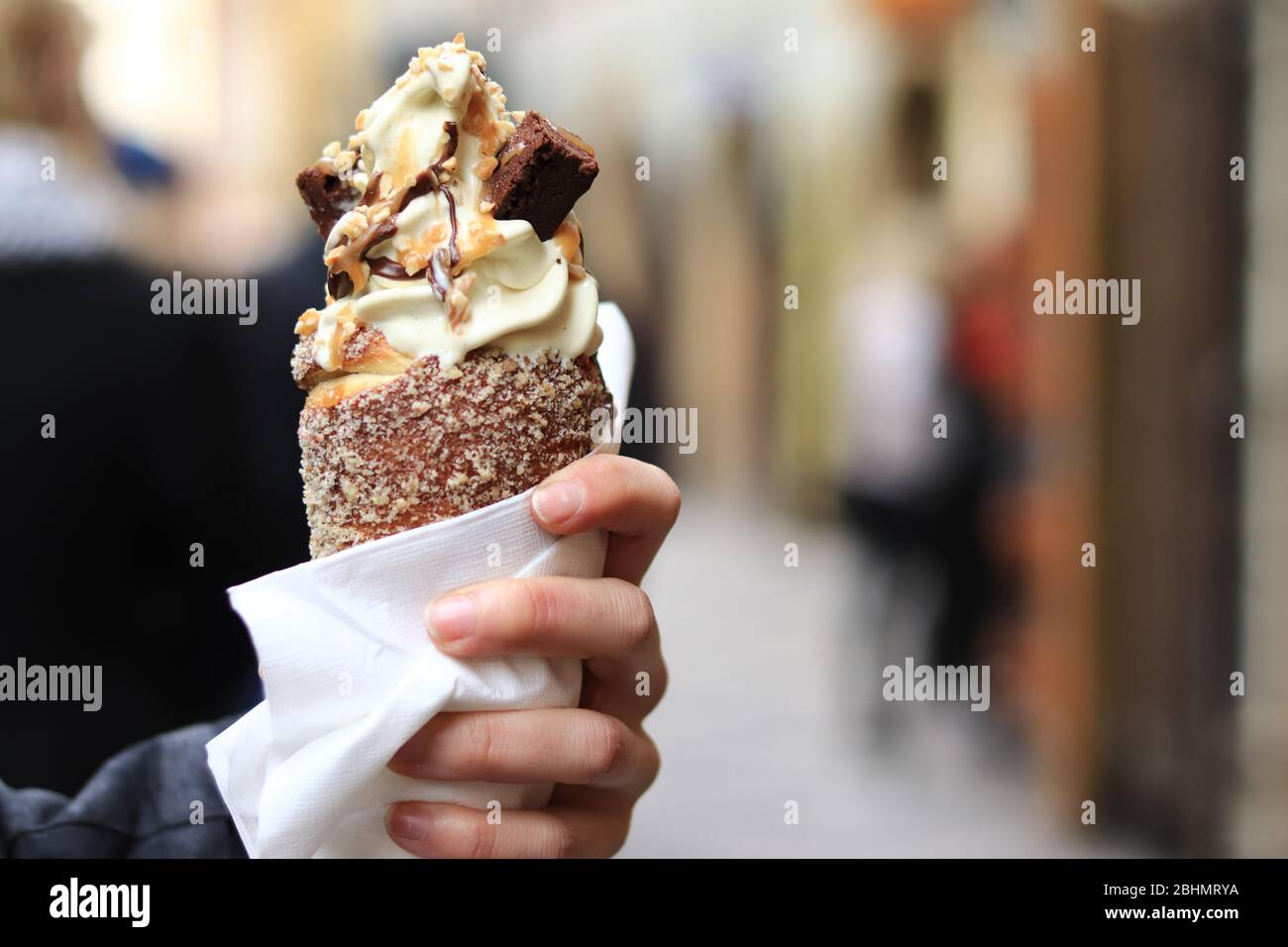 Trdelnik traditional Czech pastry dessert, Prague, Czech Republic,Rolled and grilled pasteries Stock Photo