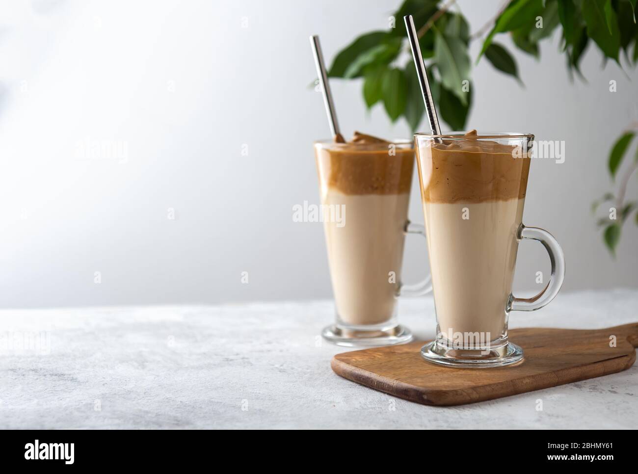 Two dalgona coffee in tall glasses on a white background background. Place for text Stock Photo
