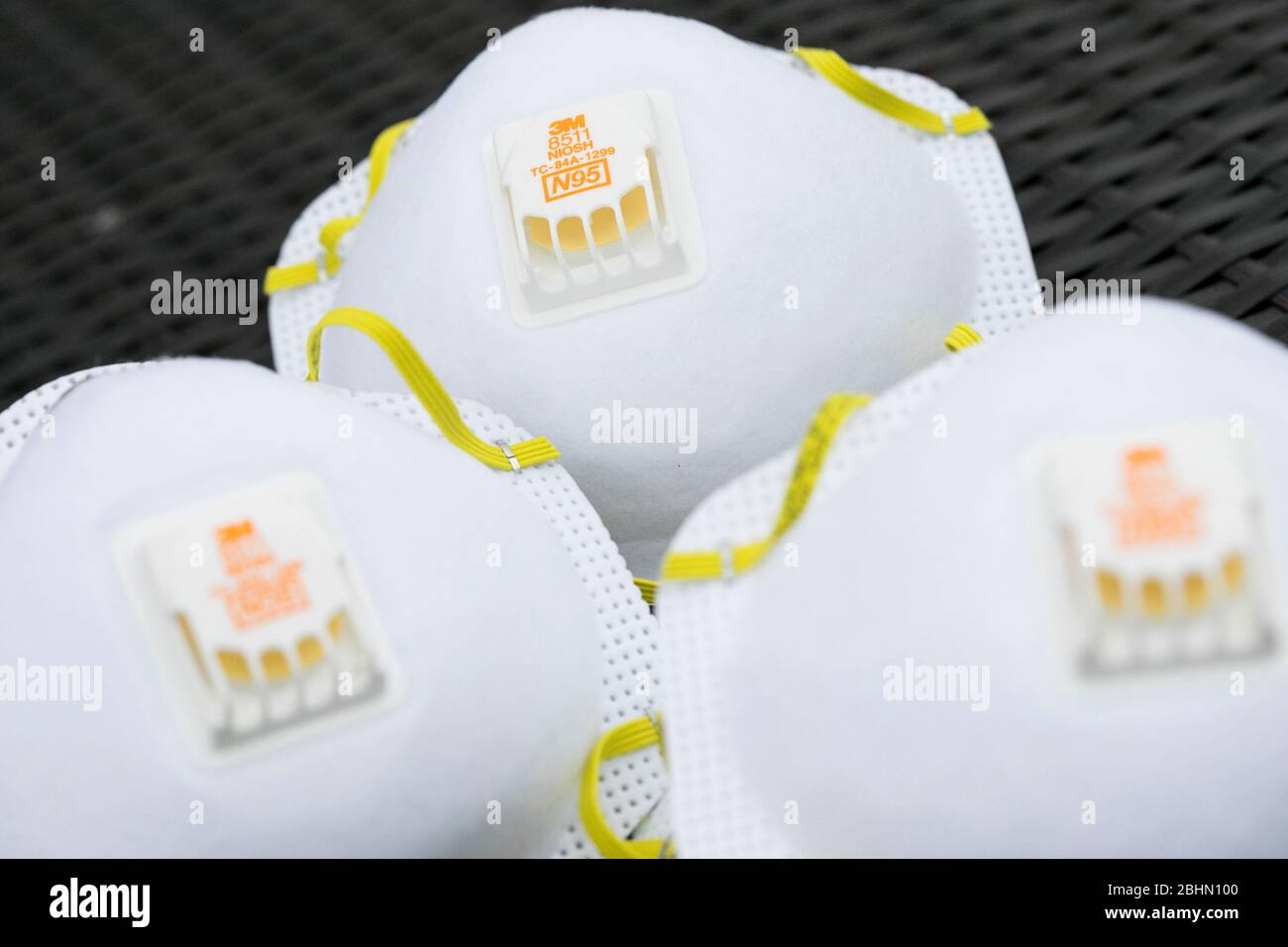 A grouping of 3M N95 respirator masks arranged for a photograph. Stock Photo