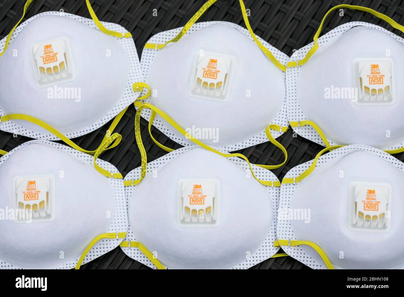 A grouping of 3M N95 respirator masks arranged for a photograph. Stock Photo
