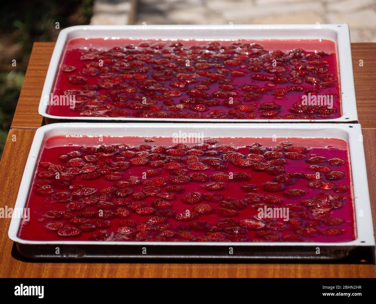 Strawberry jam is making under the sun. Jam Traditional dried with sun