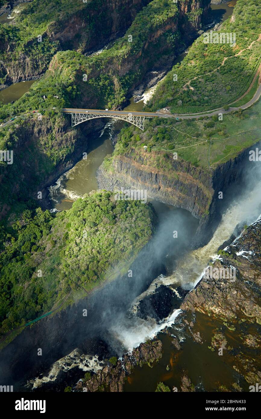 Victoria Falls or 'Mosi-oa-Tunya' (The Smoke that Thunders), Zambezi River, and Victoria Falls Bridge, Zimbabwe / Zambia border, Southern Africa - aer Stock Photo