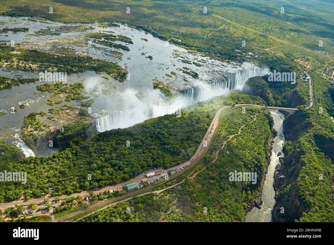 Victoria Falls or 'Mosi-oa-Tunya' (The Smoke that Thunders), Zambezi River, and Victoria Falls Bridge, Zimbabwe / Zambia border, Southern Africa - aer Stock Photo