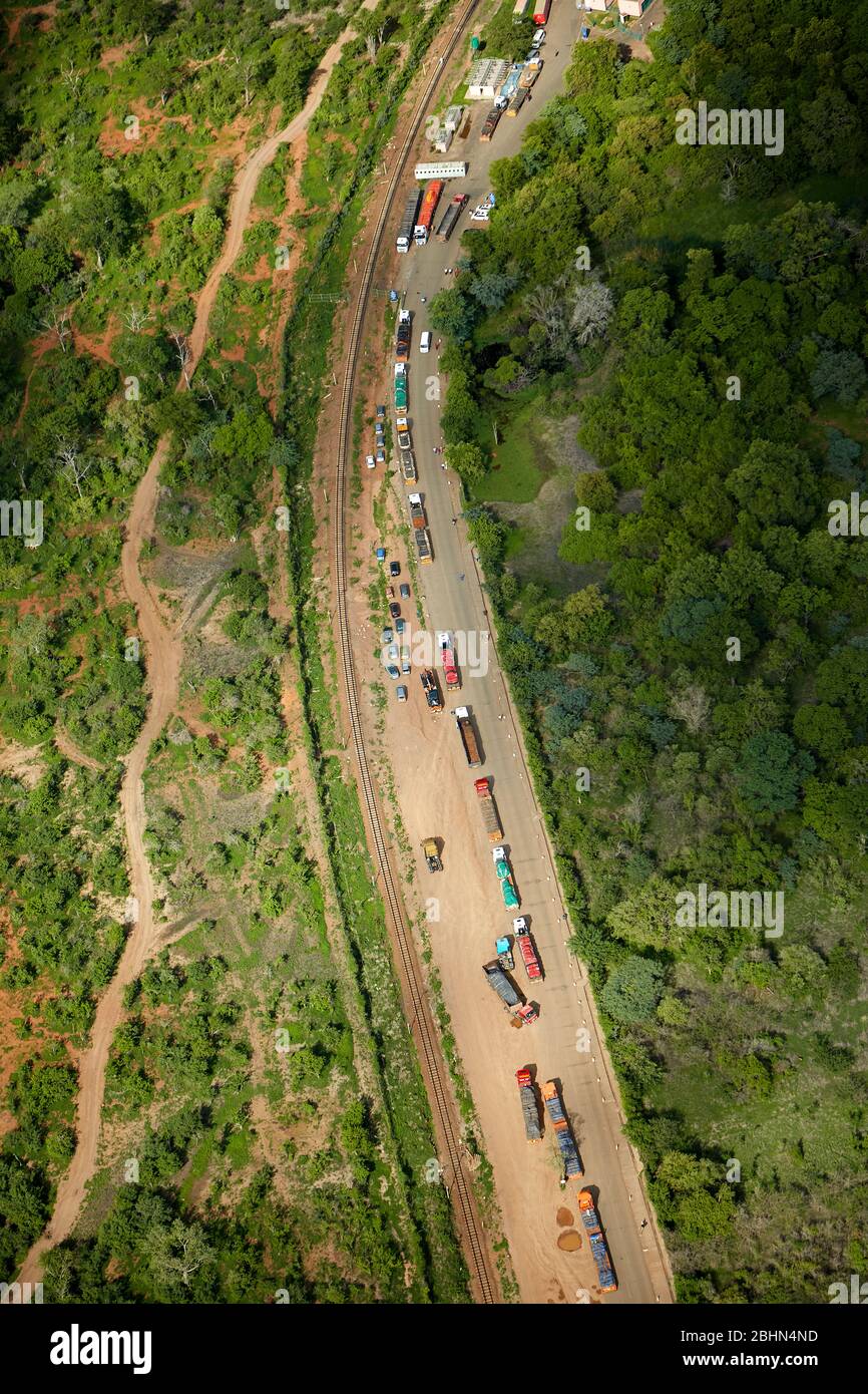 Trucks queued at border post, Victoria Falls, Zimbabwe, Africa - aerial Stock Photo