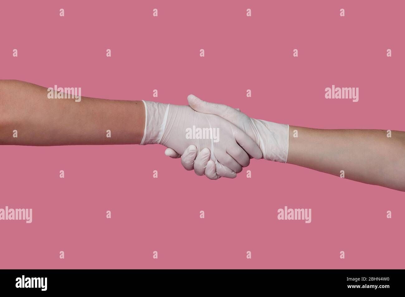 shaking hands wearing gloves Stock Photo Alamy