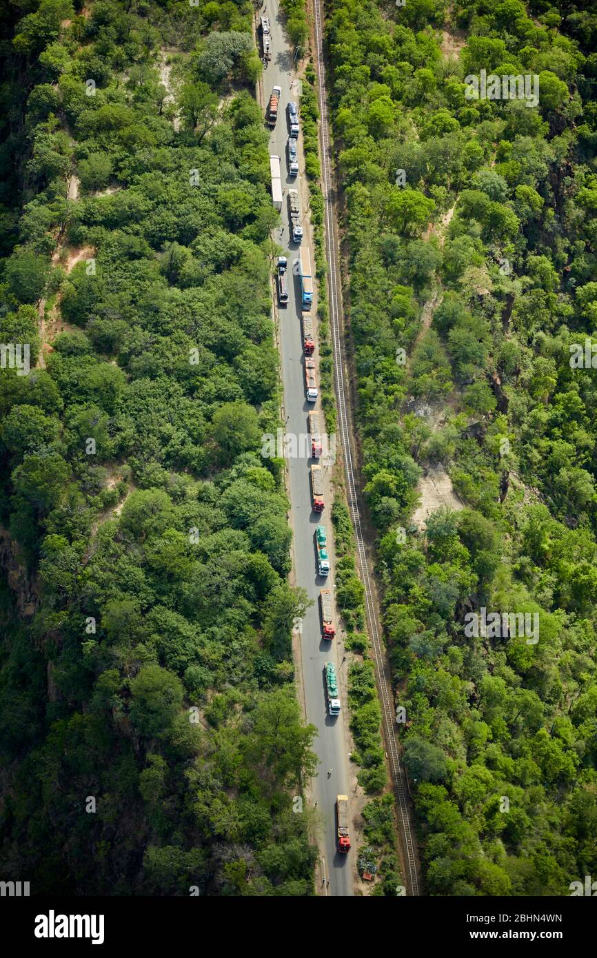Trucks queued at border post, Victoria Falls, Zimbabwe, Africa - aerial Stock Photo