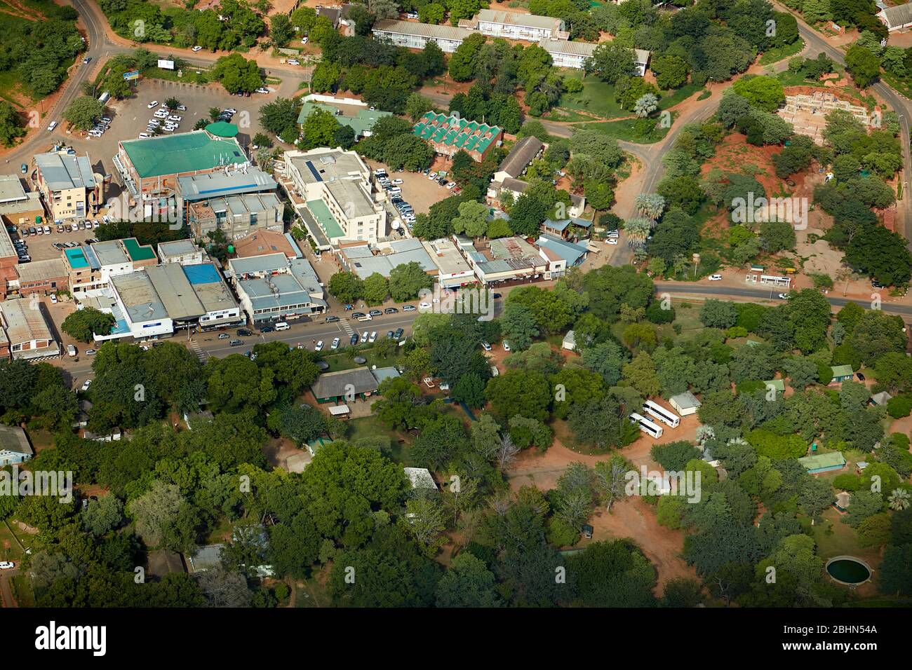 Shopping Centre, and Victoria Falls Rest Camp (bottom), Victoria Falls, Zimbabwe, Africa - aerial Stock Photo