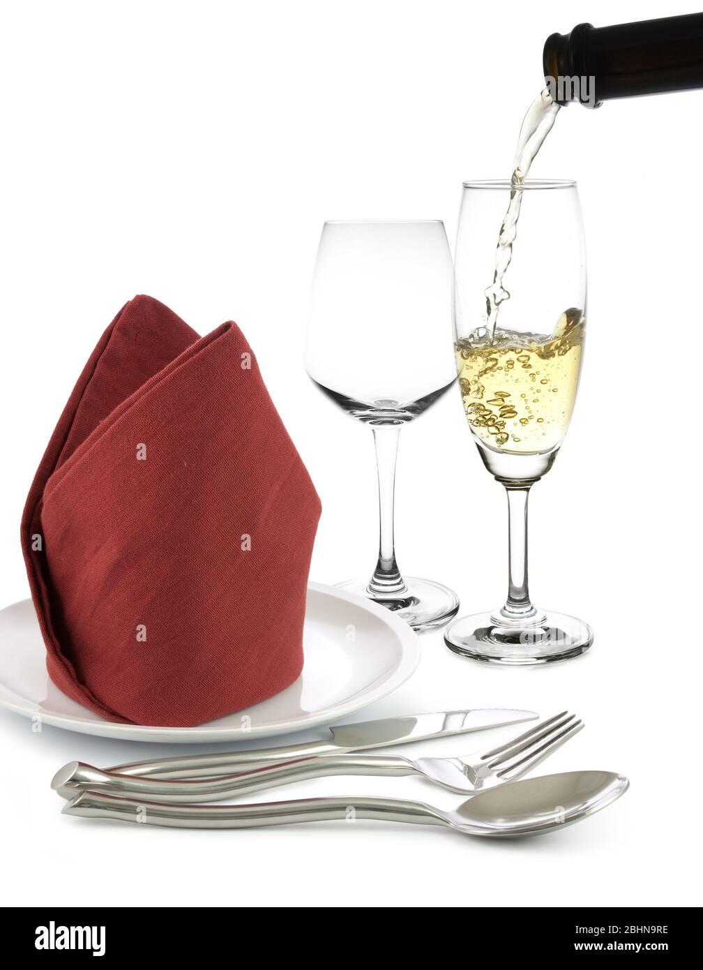 fork and knife on white napkin and wine glasses isolated on white