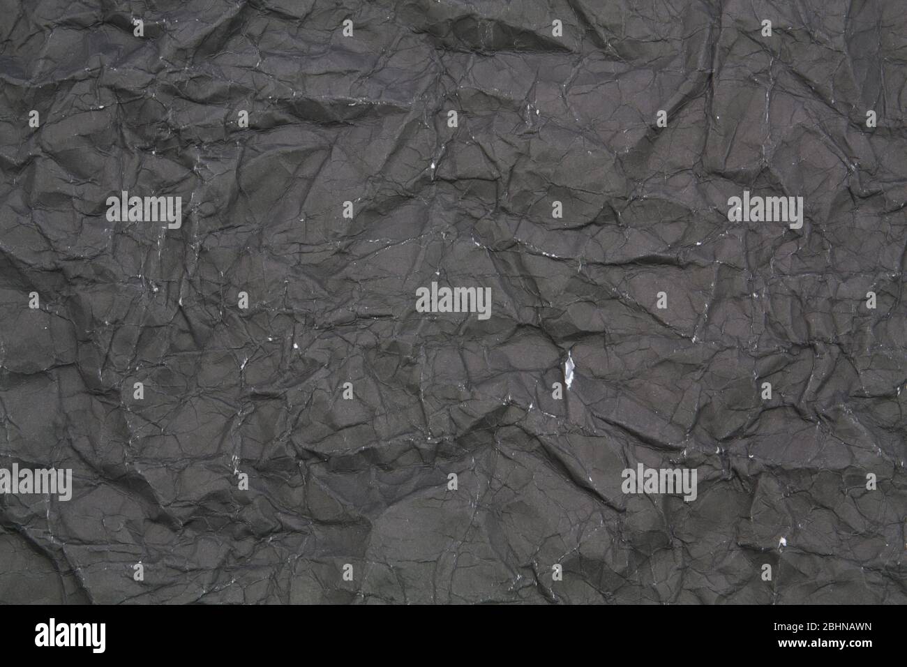 black crumpled paper texture wallpaper background Stock Photo - Alamy