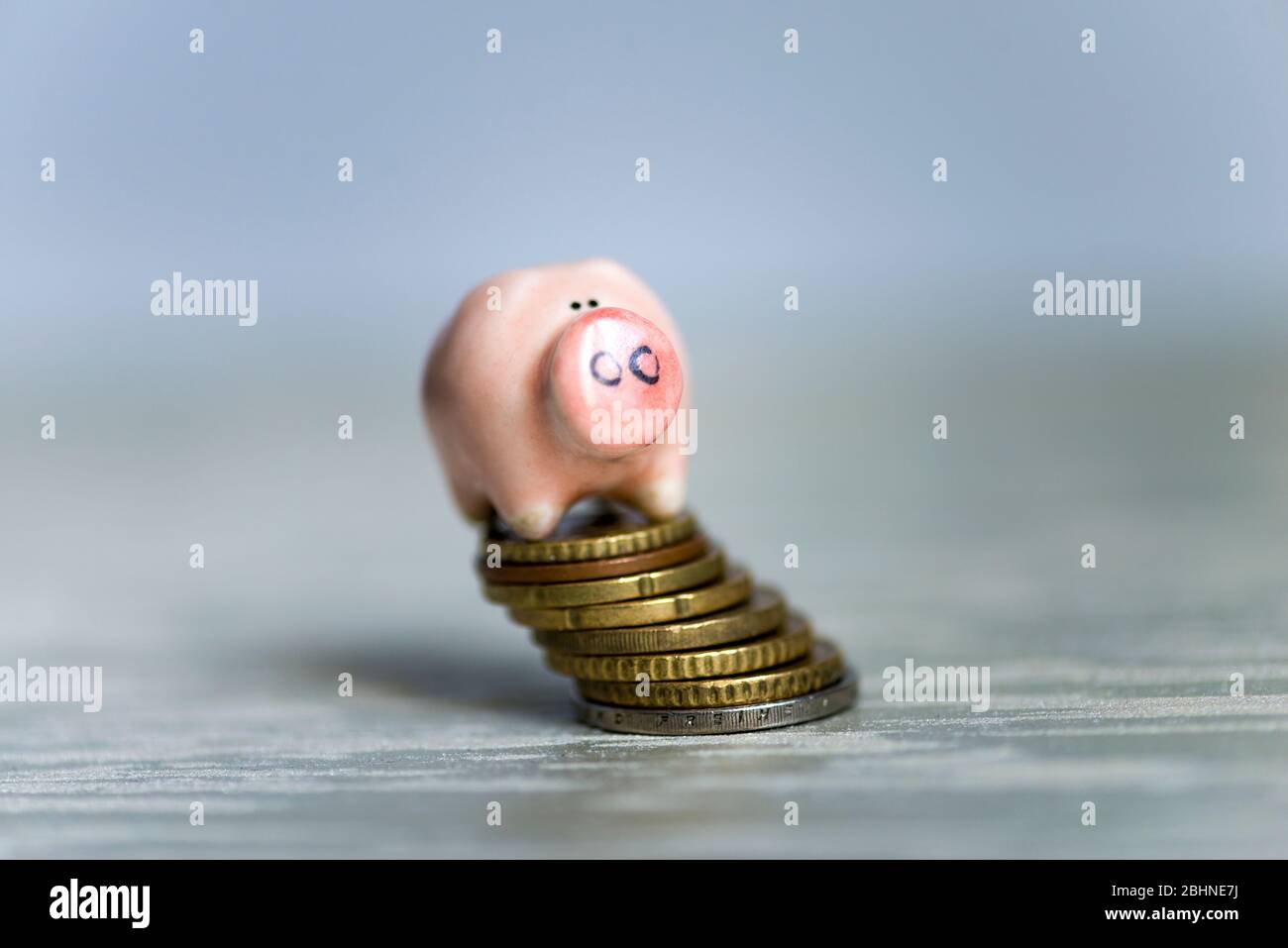 Crisis concept. Piggy bank stands at of cents. Finance and business. Economic crisis. Corona virus Covid-19 out breaking Stock Photo