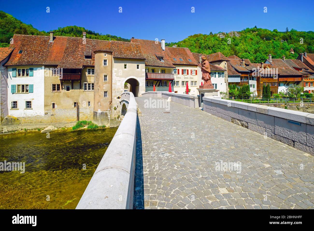 Bridge John of Nepomuk over Doubs river, Saint Ursanne. Canton Jura, Switzerland. Stock Photo