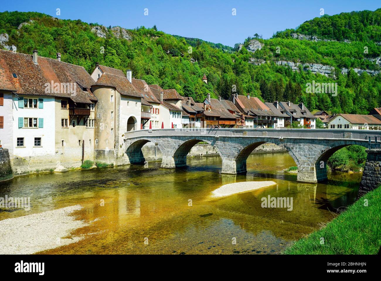 Bridge John of Nepomuk over Doubs river, Saint Ursanne. Canton Jura, Switzerland. Stock Photo