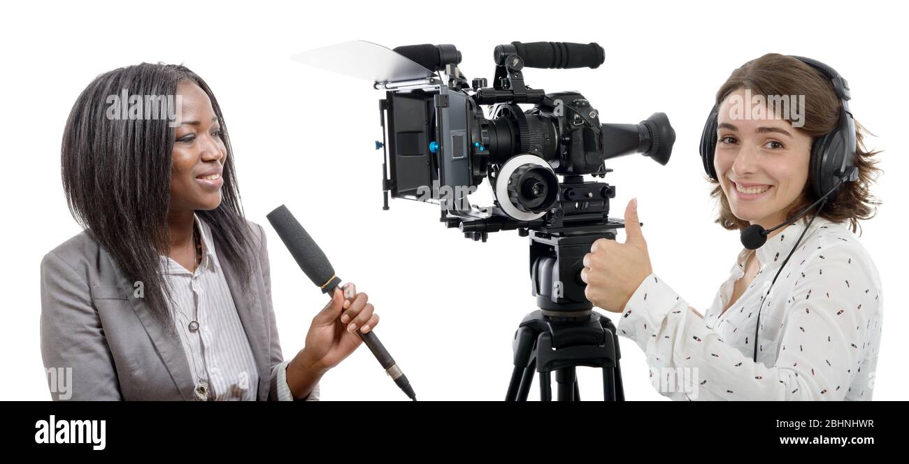 two beautiful reporter women with a camera and microphone Stock Photo ...