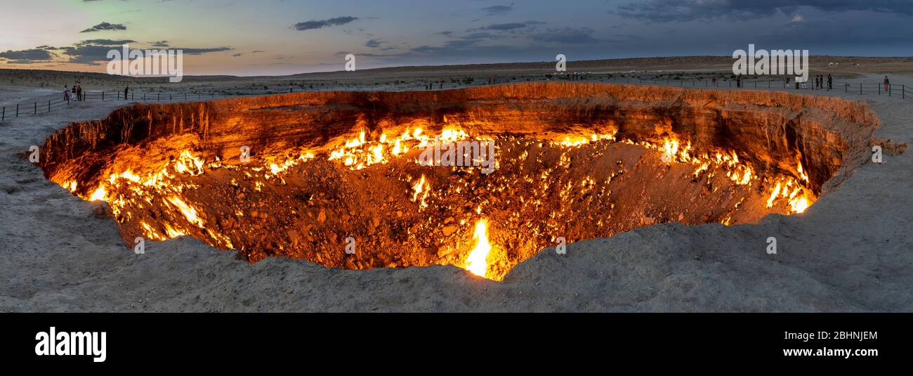 Panorama of th fire of the Darwaza  (Derweze) gas crater in the Karakum Desert in Turkmenistan. Stock Photo