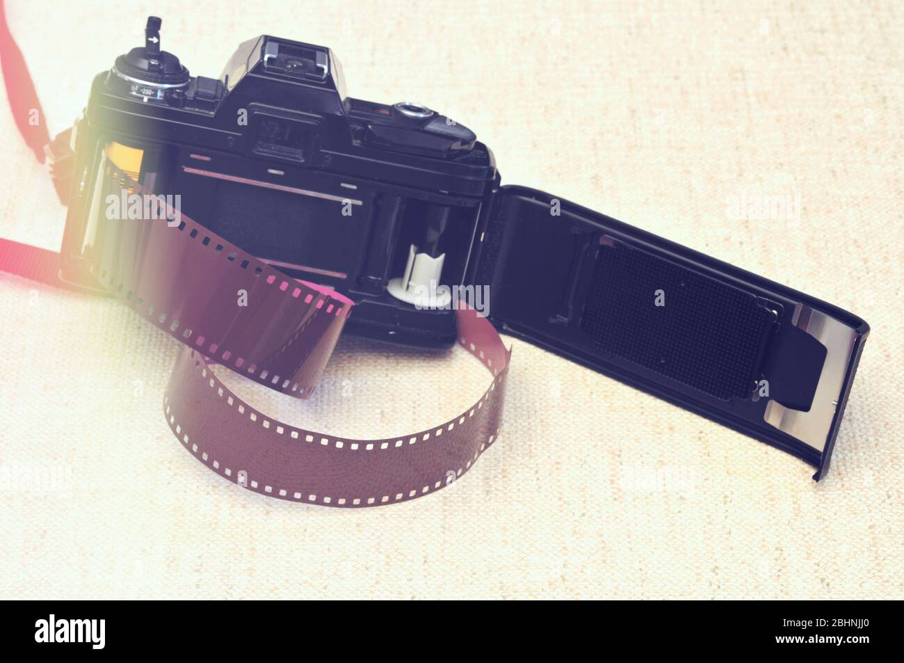 35mm film camera with open back door and light leak Stock Photo - Alamy