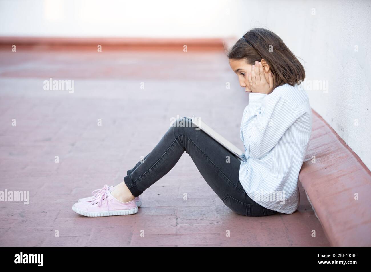 Female sitting on floor hi-res stock photography and images - Alamy