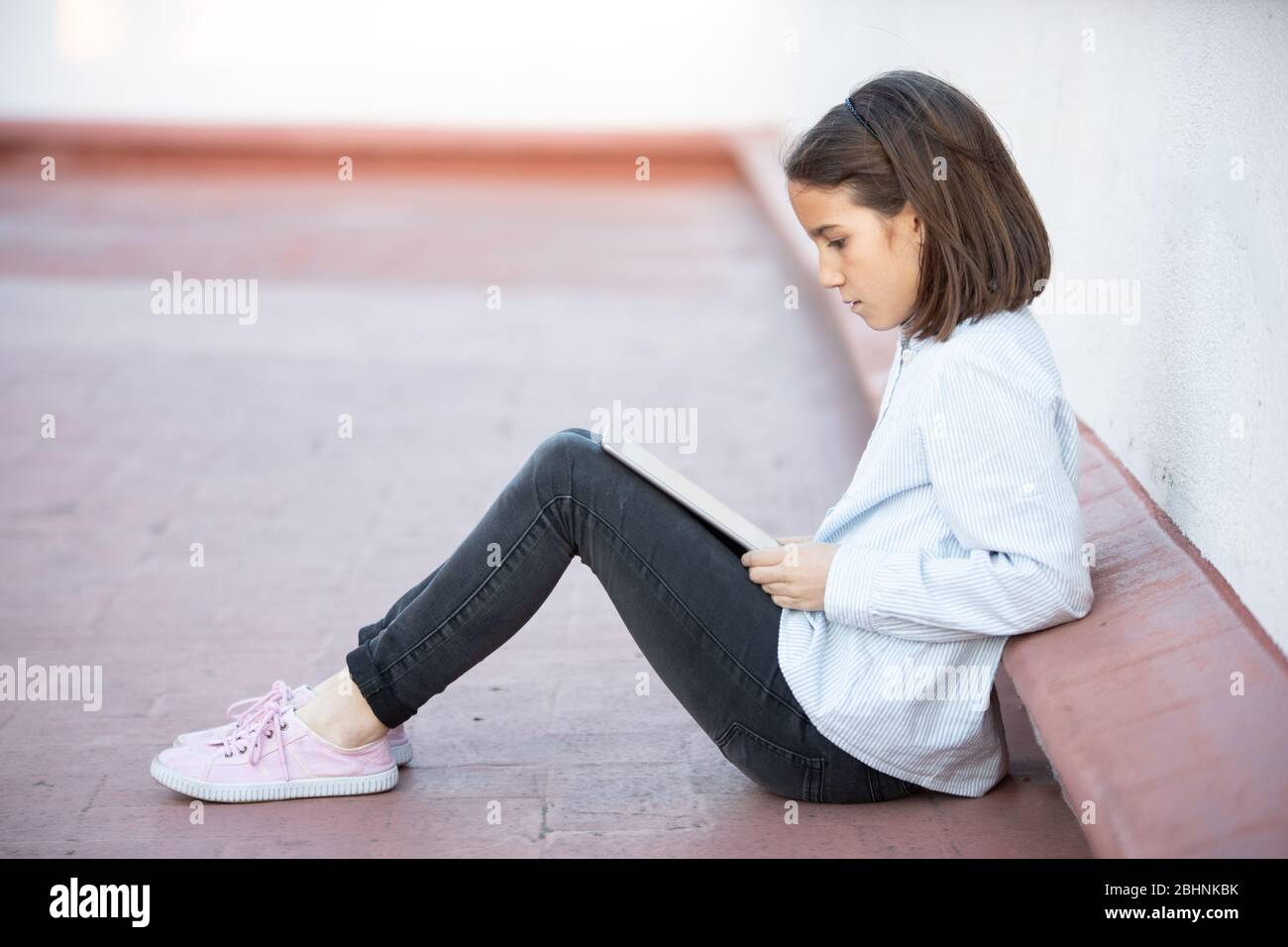 Female sitting on floor hi-res stock photography and images - Alamy