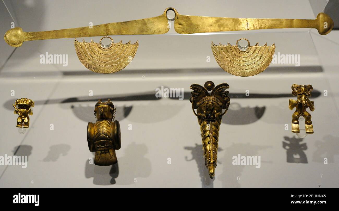 Antropomorphic pendant, gold, Quimbaya culture. Raptor figure pendant, golden copper, Tairona culture. Pendant depicting a fantastic, gold, Tairona culture. Antropomorphic pendant, gold, Tairona culture. Integration period (800-1500 AD). Colombia. Museum of the Americas. Madrid, Spain. Stock Photo