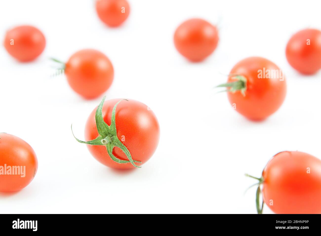 organic red tomatoes on white background Stock Photo - Alamy