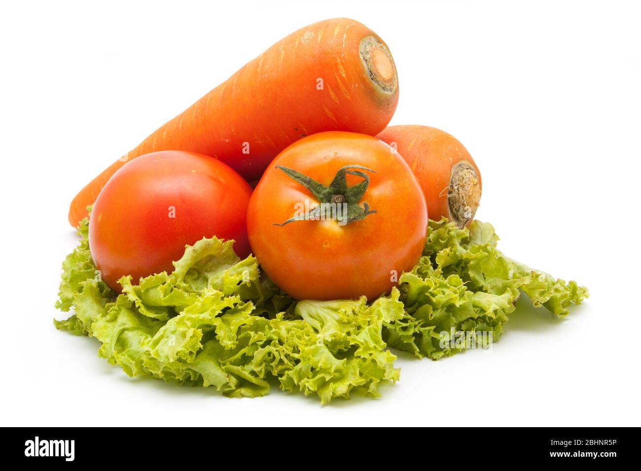 fresh vegetables carrot and tomato isolated Stock Photo - Alamy