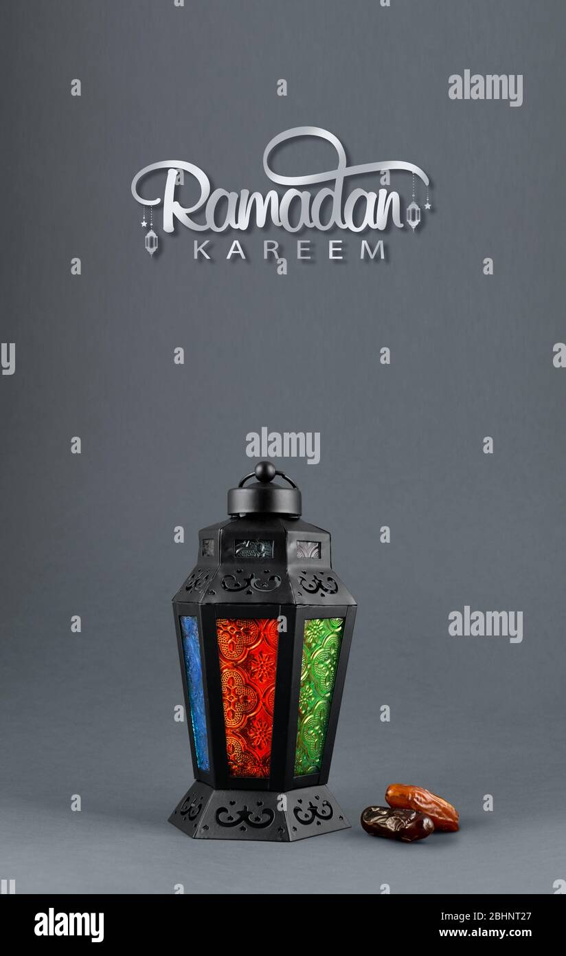 Ramadan and Eid concept gray color background with dates and arabic traditional lantern Light Lamp Stock Photo