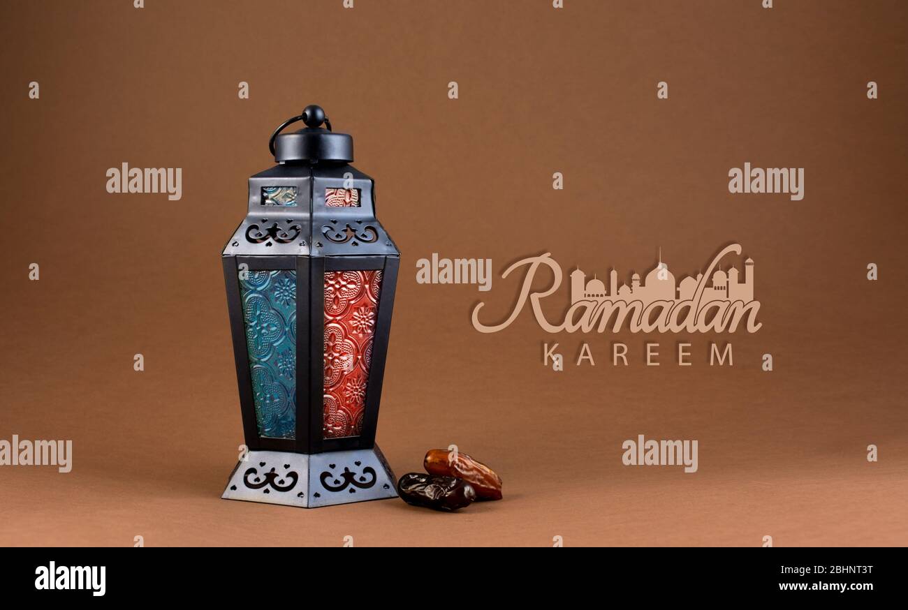 Ramadan Kareem cream color Background, arabic Lantern lights lamp with dates and new Ramadan typography Stock Photo