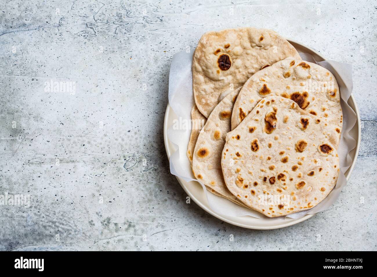 Homemade indian pita chapati on a gray background. Vegetarian cuisine