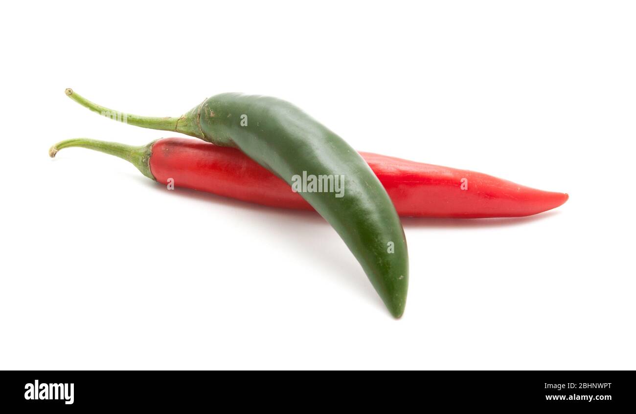 Red and green hot chili peppers isolated on white background closeup ...