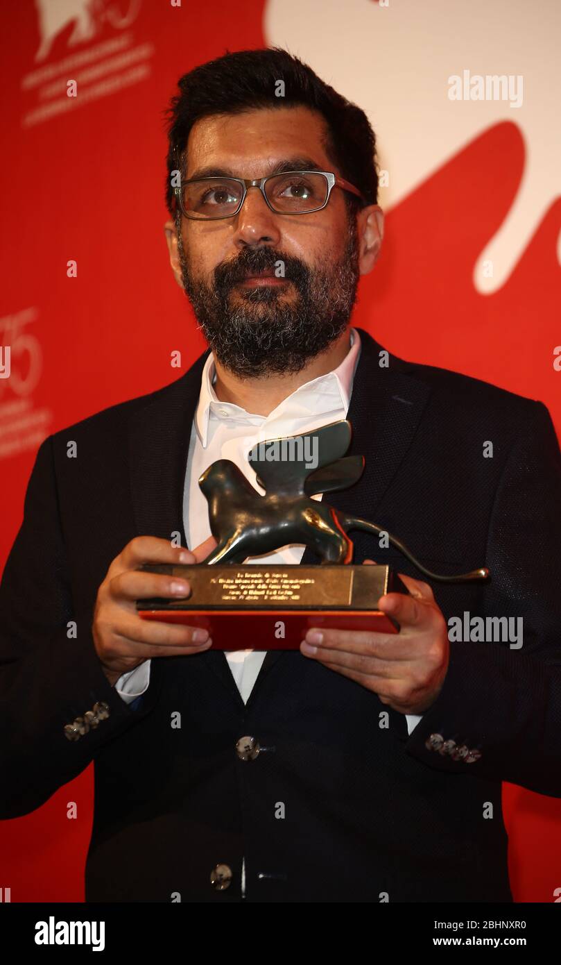VENICE, ITALY - SEPTEMBER 08: Mahmut Fazil Coskun poses with the Special Orizzonti Jury Prize for 'The Announcement (Anons)' at the Winners Photocall Stock Photo