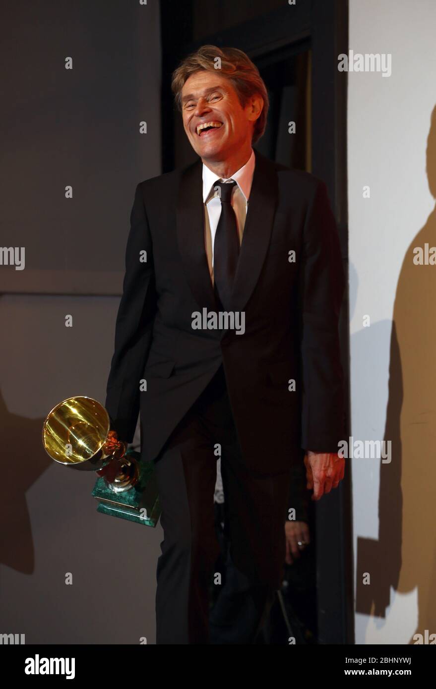VENICE, ITALY - SEPTEMBER 08: Willem Dafoe poses with the Coppa Volpi for 'At Eternity's Gate' at the Winners Photocall Stock Photo