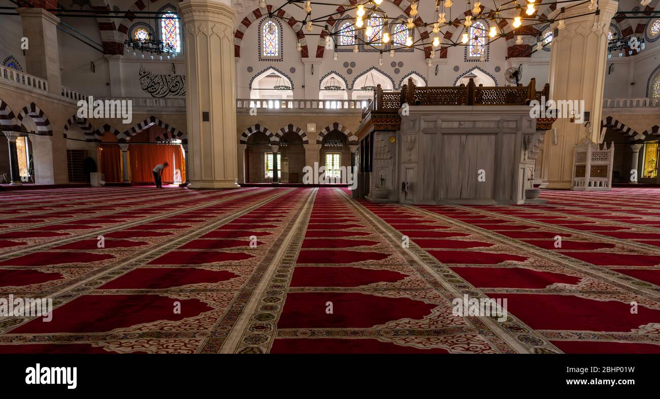 Ashgabat, Turkmenistan - June 1, 2019: Interior of the Ertugrul Gazi Mosque, courtyard, in the white and marble city of Asjchabad with great buildings Stock Photo