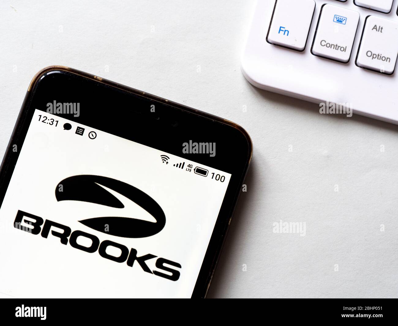 In this photo illustration Brooks Running logo is seen displayed on a