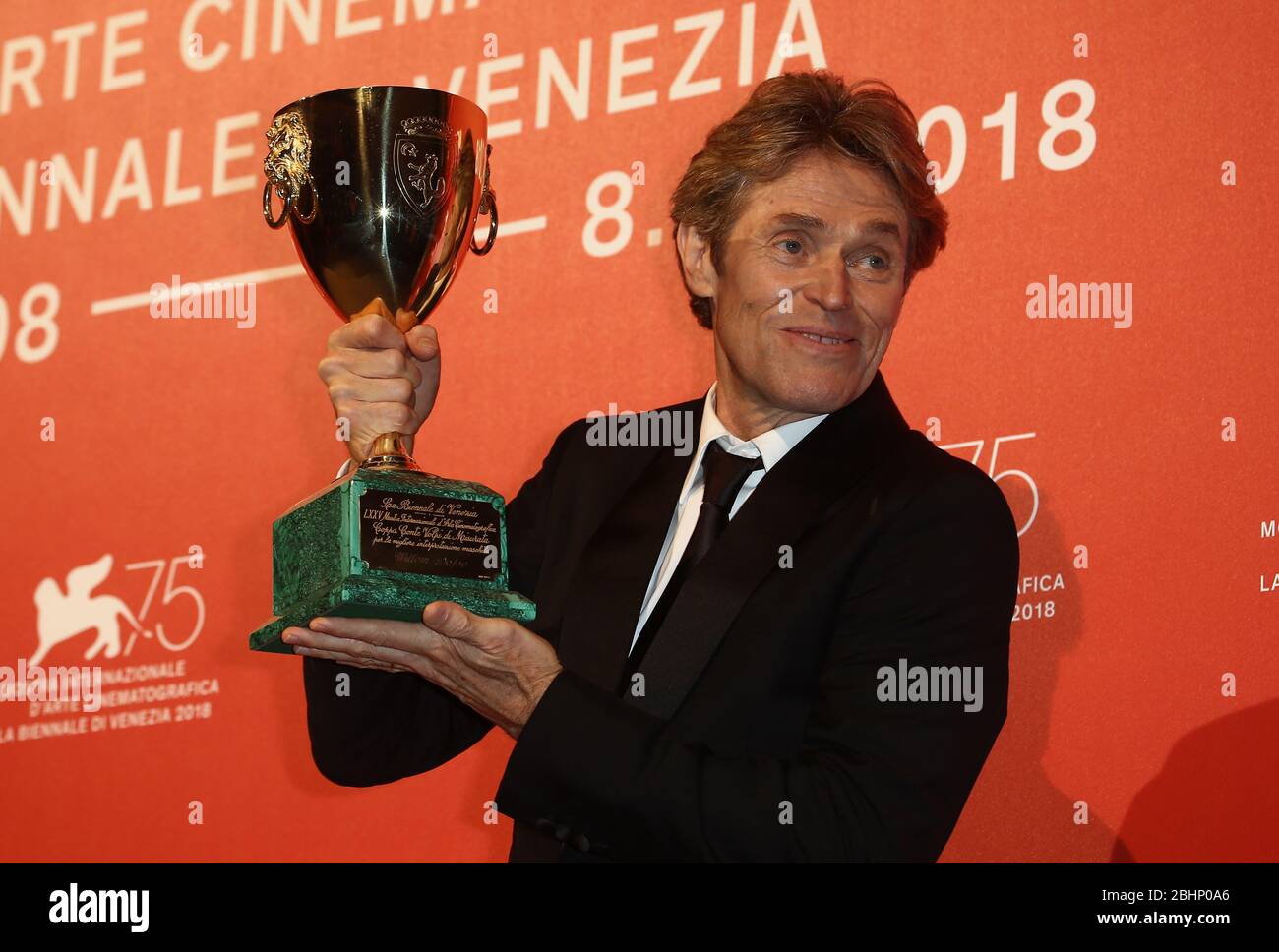 VENICE, ITALY - SEPTEMBER 08: Willem Dafoe poses with the Coppa Volpi for 'At Eternity's Gate' at the Winners Photocall Stock Photo