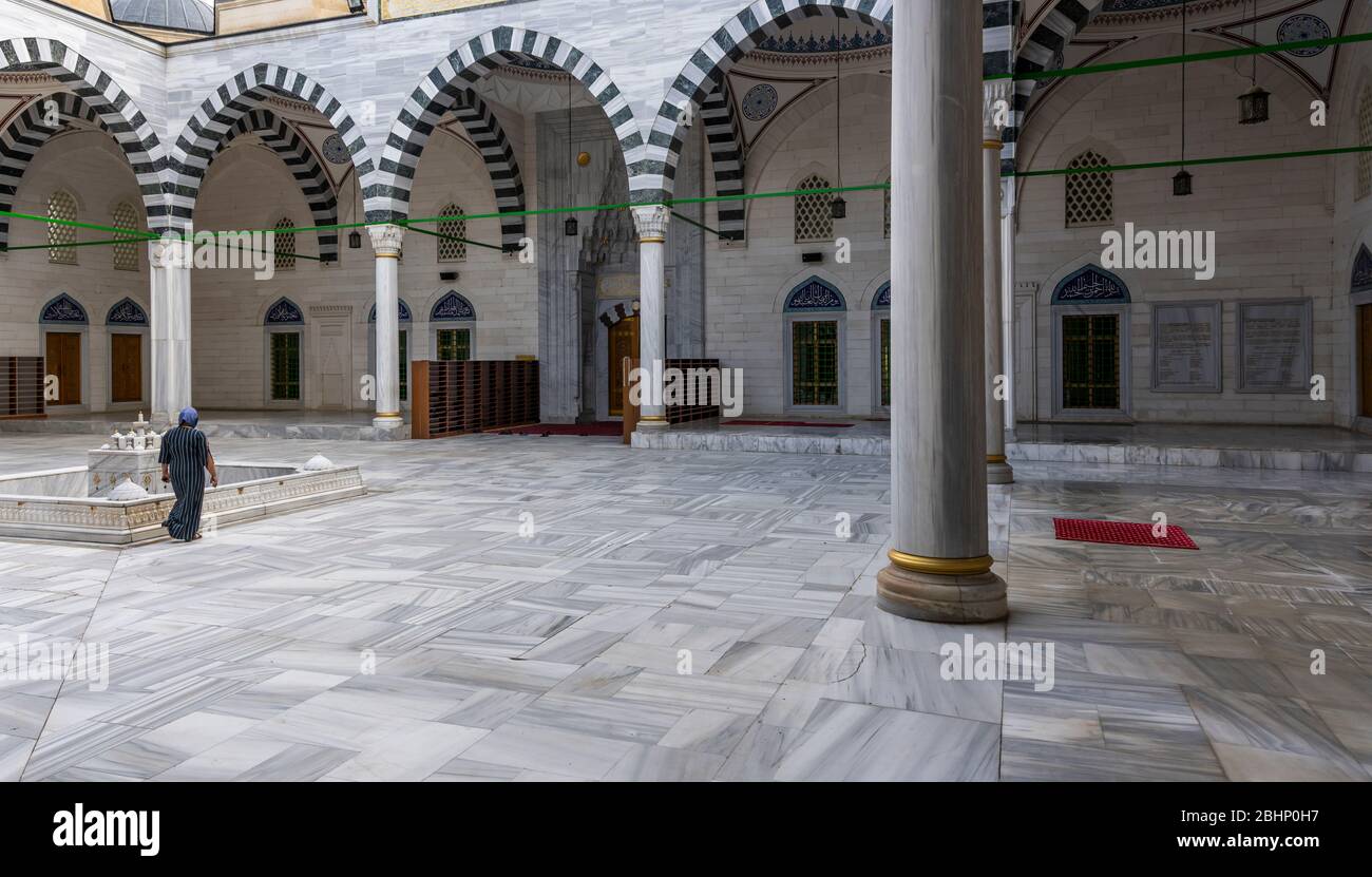Ashgabat, Turkmenistan - June 1, 2019: The Ertugrul Gazi Mosque, courtyard, in the white and marble city of Asjchabad with great buildings and landmar Stock Photo