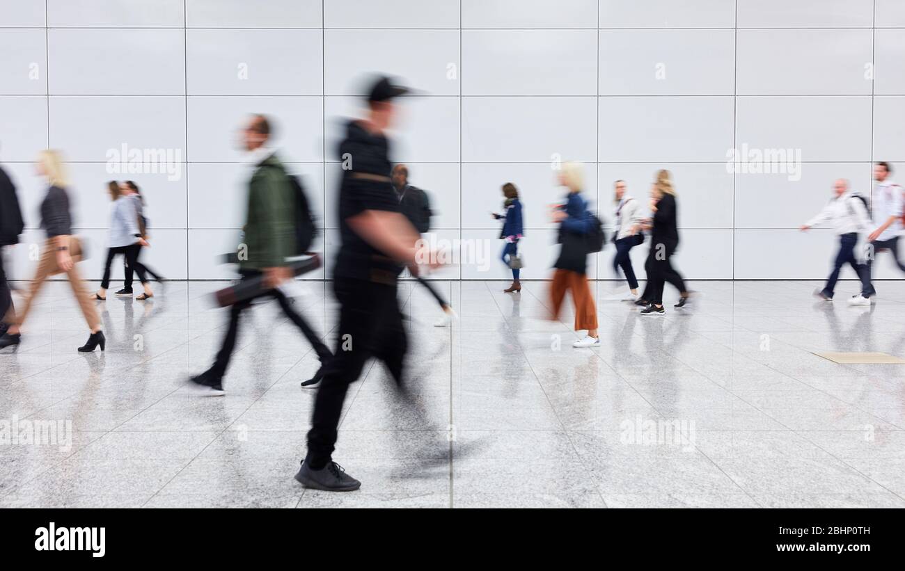 Anonymous group of people goes shopping in the mall Stock Photo