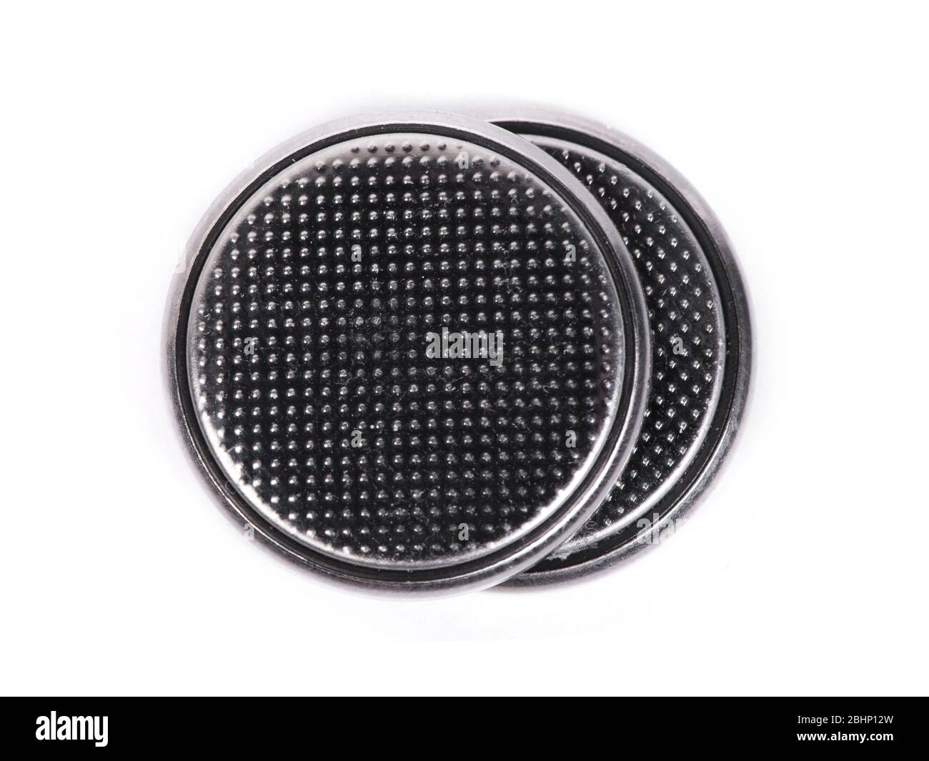 Flat lithium round button cell battery isolated on white background Stock Photo
