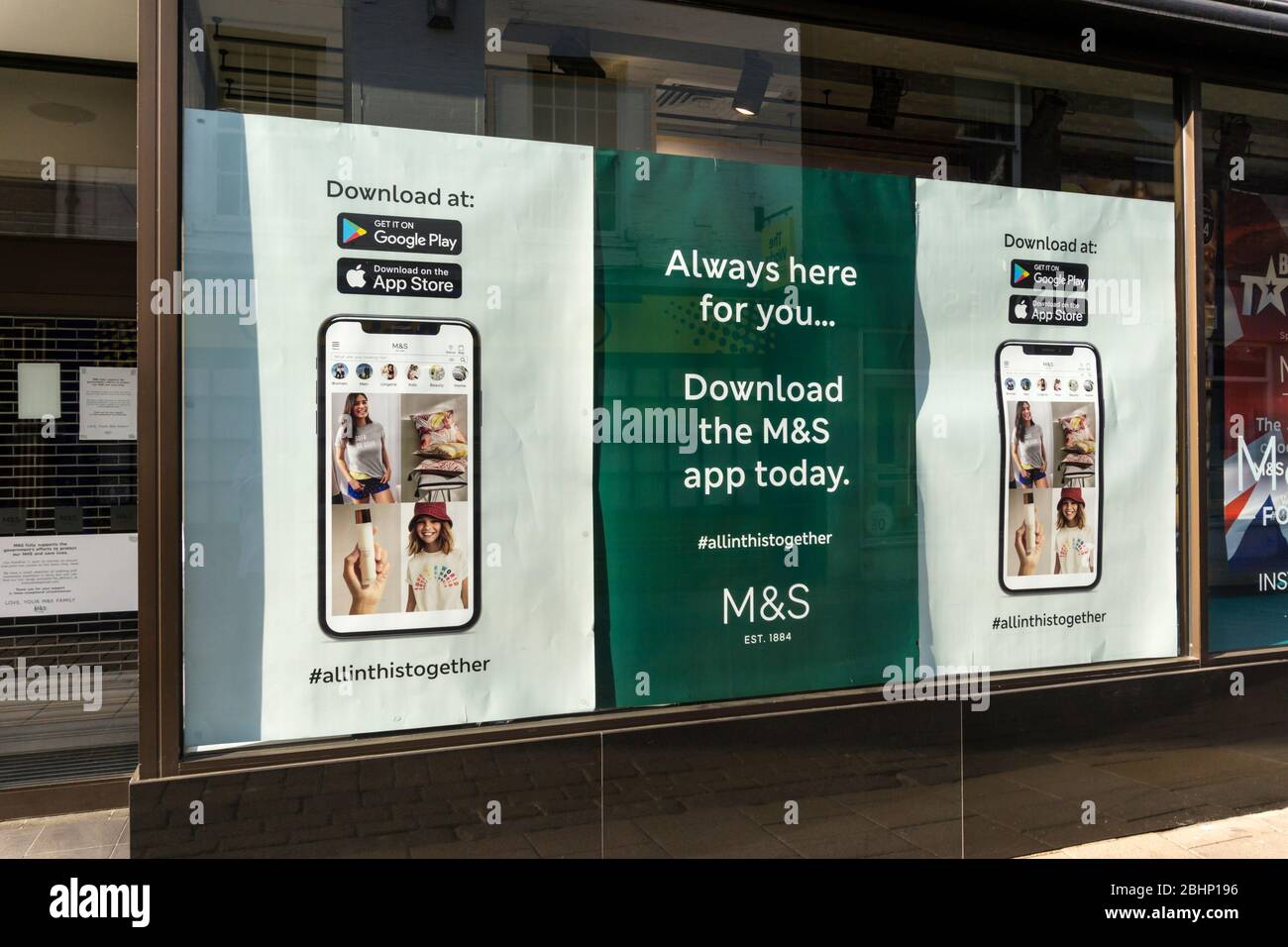 Promotion for the M&S App in a shop window during the 2020 COVID-19 Coronavirus pandemic. Stock Photo
