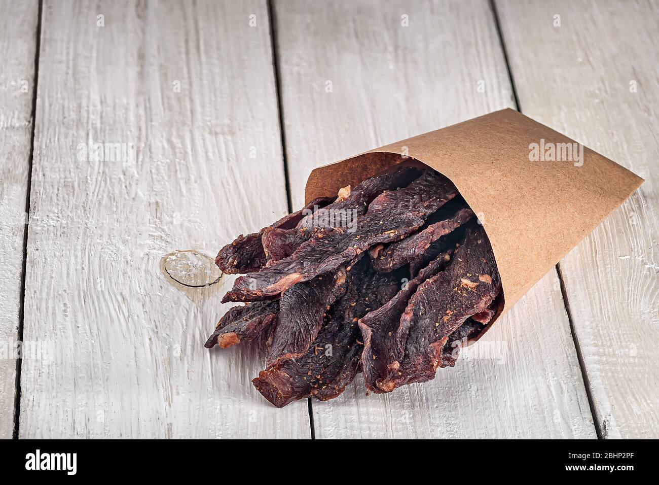 Jerky in a paper bag Stock Photo