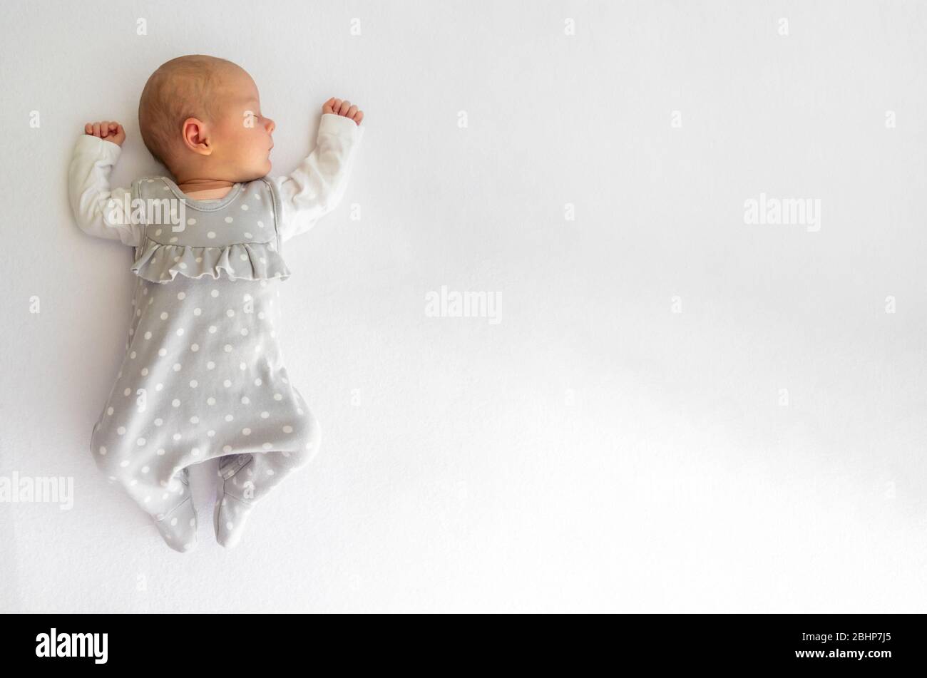 Close-up portrait of a beautiful newborn baby on white background Stock Photo