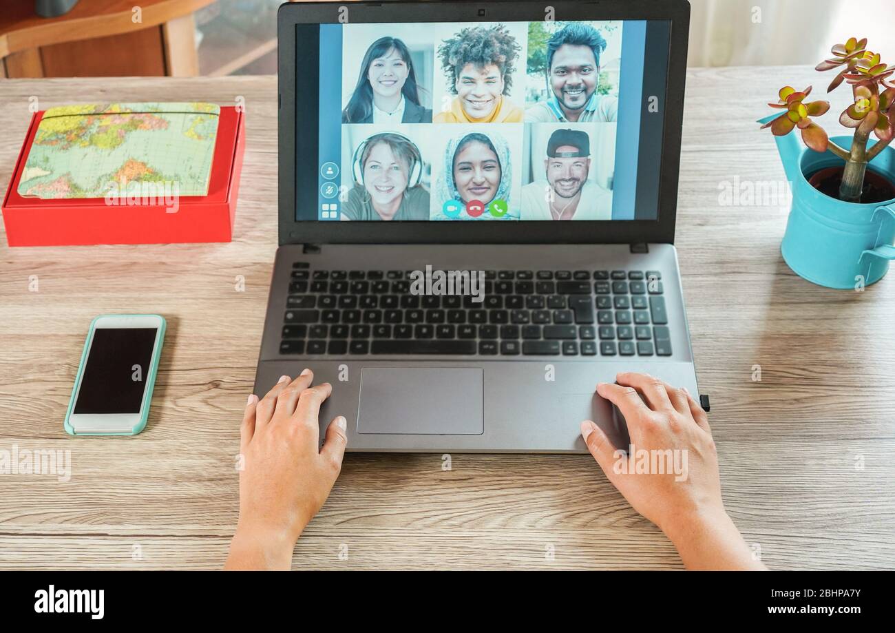 Woman teacher having a video call with multiracial students during isolation quarantine - Group of people chatting online - Technology and friendship Stock Photo