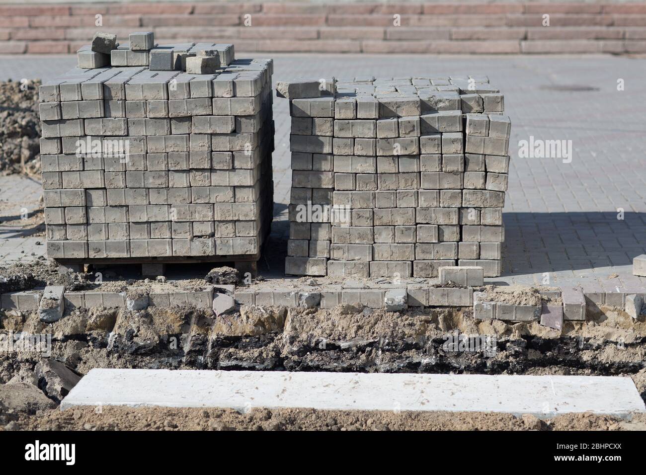 Stacked road tiles. Broken surface. Stock Photo